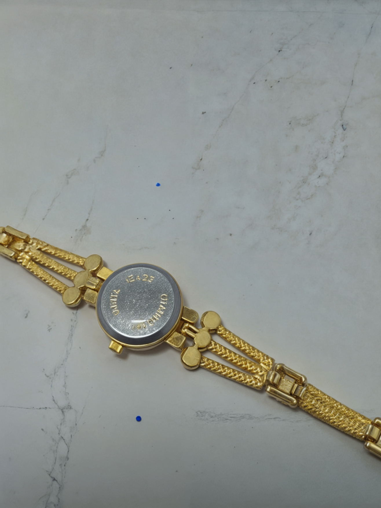 gold bracelet watch backside