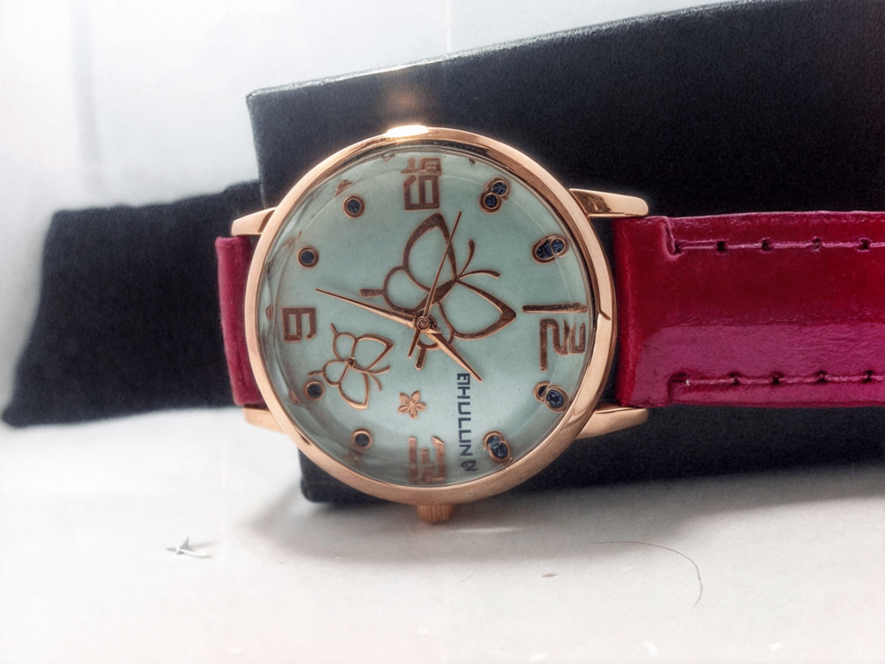 pink strap watch with butterflies